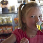 Little Girl Drinking Apple Juice